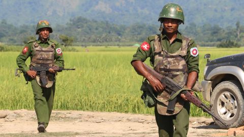 In this photograph taken on October 21, 2016, armed Myanmar army soldiers patrol a village in Maungdaw, Rakhine State following the October 9, 2016 attacks.