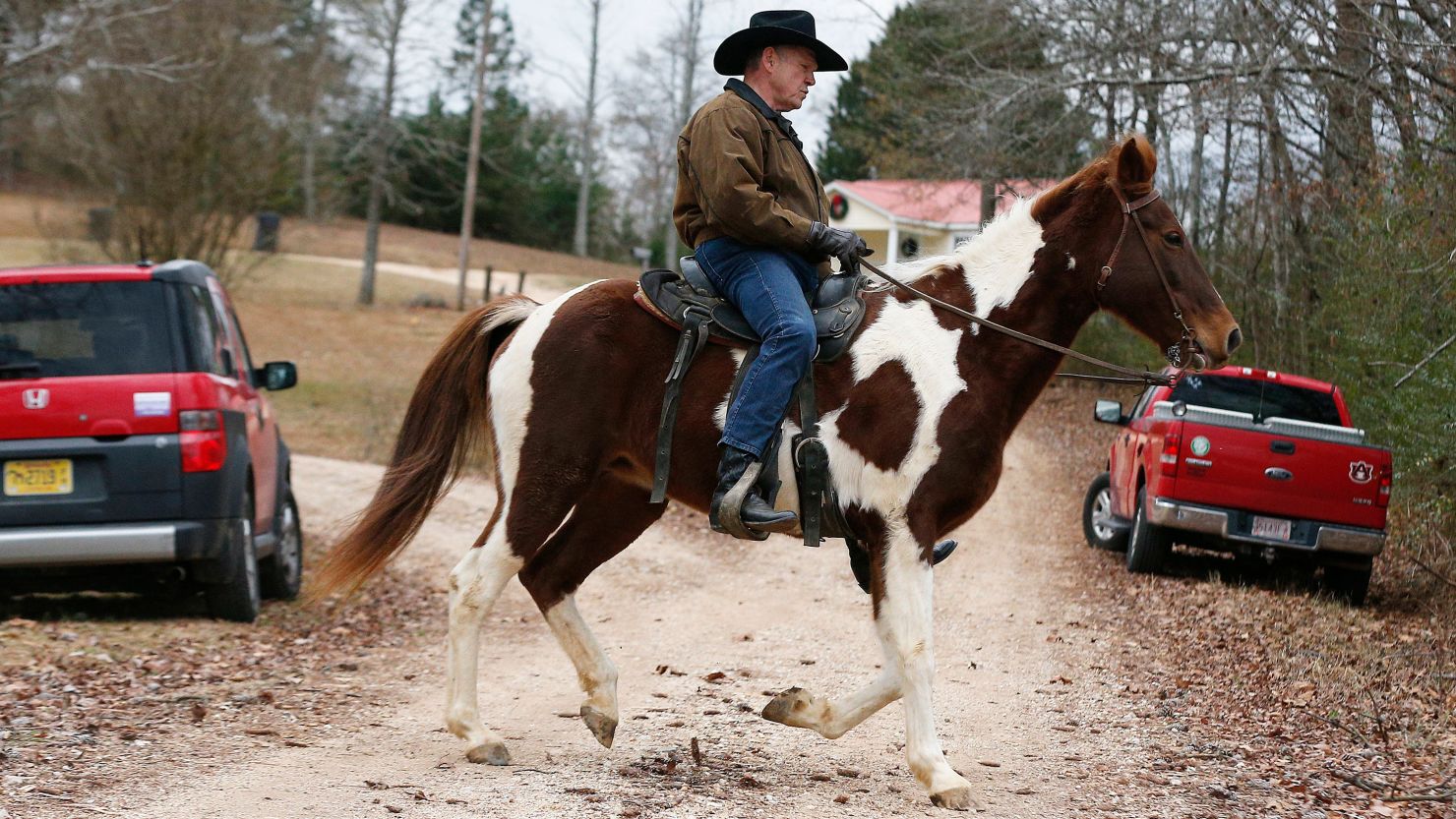 Roy Moore rides a horse to vote on December 12, 2017, in Gallant, Alabama.