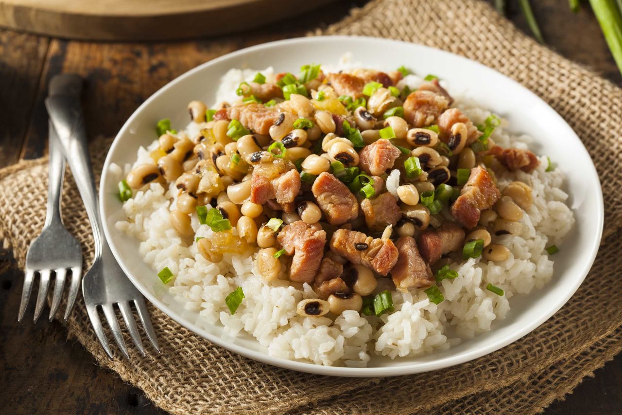 Hoppin' John is a tradition in the American South. Its core ingredients are black-eyed peas (or field peas) and rice. 