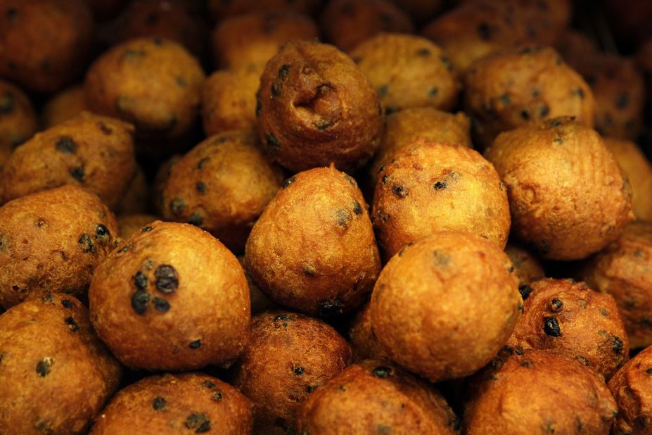 Oliebollen, or fried oil balls, are sold at street carts in The Netherlands during New Year's celebrations.