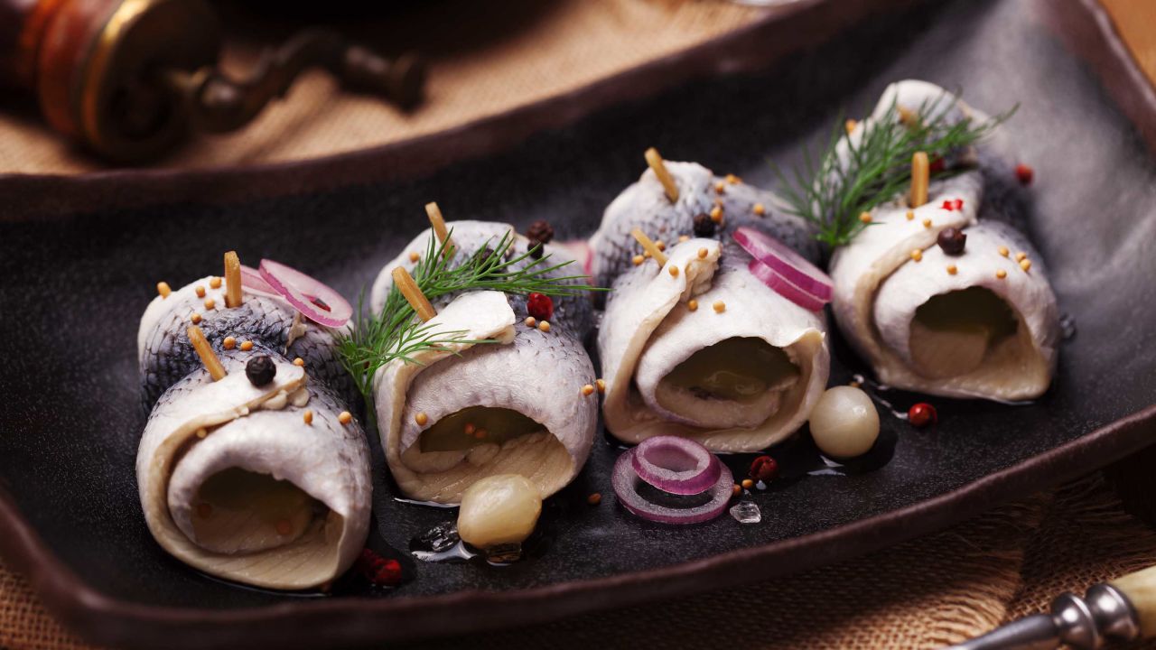 Rolled herring in vinegar, served with onions and pickles. 