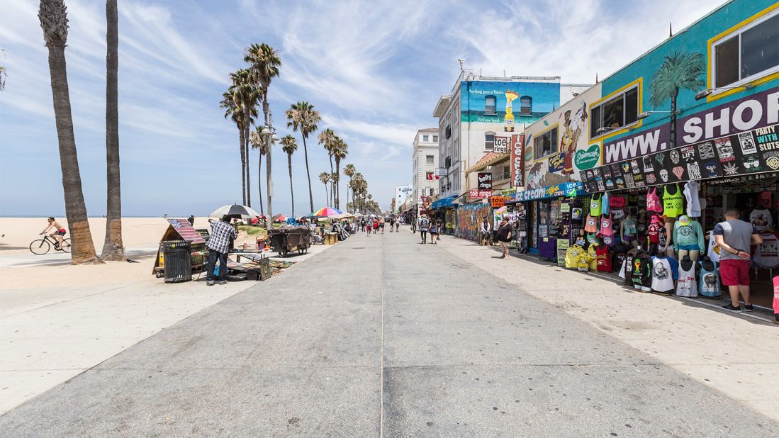 Venice Beach's famous boardwalk is home to surf shops, bikes and a drum circle.
