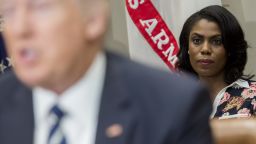 Omarosa Manigault (R), White House Director of Communications for the Office of Public Liaison, sits behind US President Donald Trump as he speaks during a meeting with teachers, school administrators and parents in the Roosevelt Room of the White House in Washington, DC, February 14, 2017. SAUL LOEB/AFP/Getty Images