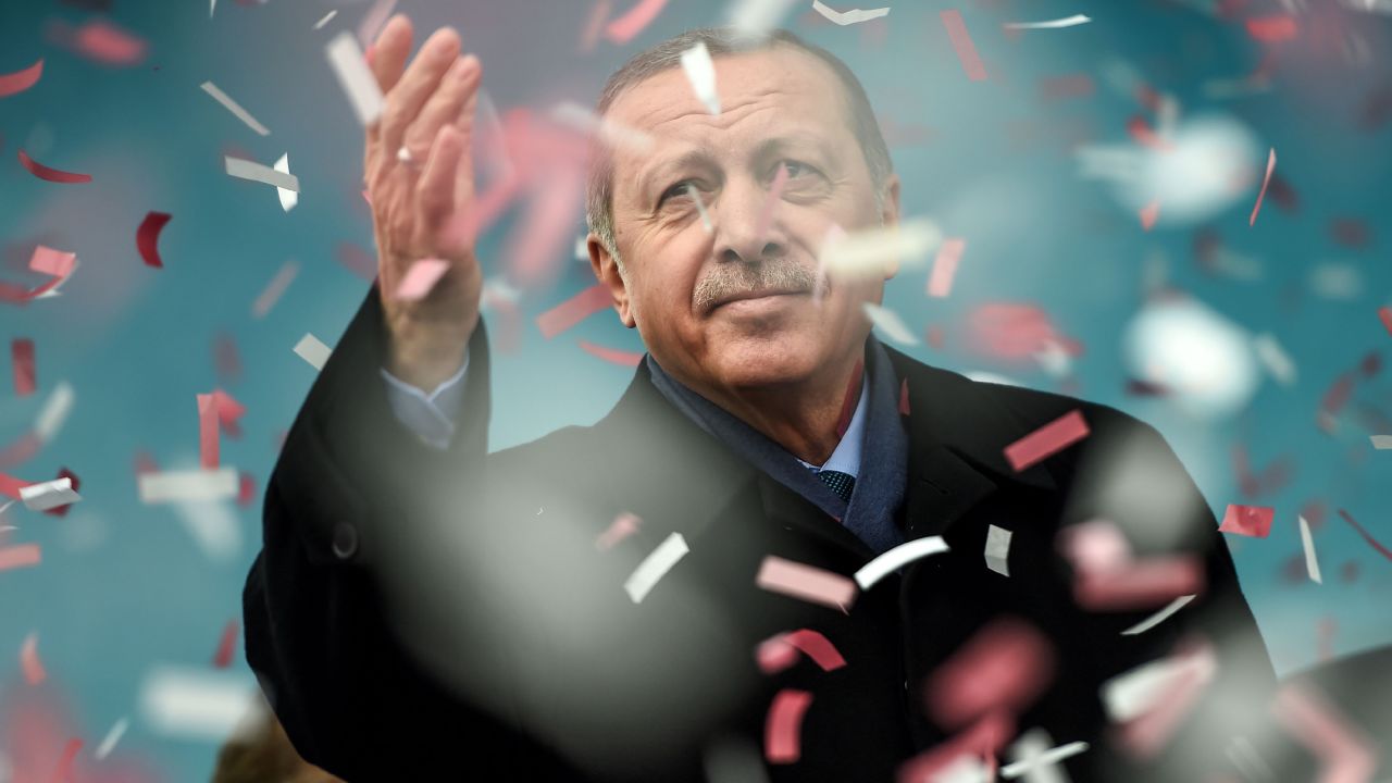 Turkish President Recep Tayyip Erdogan gestures amid confetti during a rally in Istanbul.