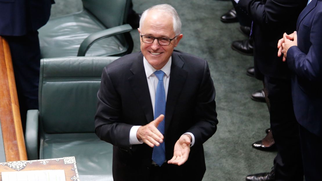 Australian Prime Minister Malcolm Turnbull applauds after the passage of the same-sex marriage bill in the federal Parliament.