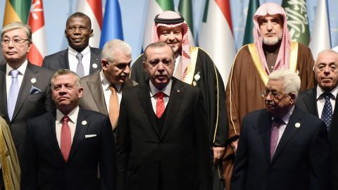 Turkish President Erdogan (front row, C) and Palestinian Authority President Abbas (front row, R) with other leaders at the OIC summit