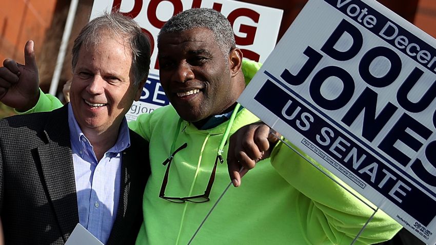 BESSEMER, AL - DECEMBER 12:  Democratic senatorial candidate Doug Jones takes a picture with voters outside of a polling station at the Bessemer Civic Center on December 12, 2017 in Bessemer, Alabama. Doug Jones is facing off against Republican Roy Moore in a special election for U.S. Senate.  (Photo by Justin Sullivan/Getty Images)