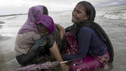 DAKHINPARA, BANGLADESH - SEPTEMBER 12:  Rohingya refugee woman break down in tears after jumping from a wooden boat that began to tip over as it hit the shore on September 12, 2017 in Dakhinpara, Bangladesh. Recent reports have suggested that around 290,000 Rohingya have now fled Myanmar after violence erupted in Rakhine state. The 'Muslim insurgents of the Arakan Rohingya Salvation Army' have issued statement that indicates that they are to observe a cease fire, and have asked the Myanmar government to reciprocate.  (Photo by Dan Kitwood/Getty Images)