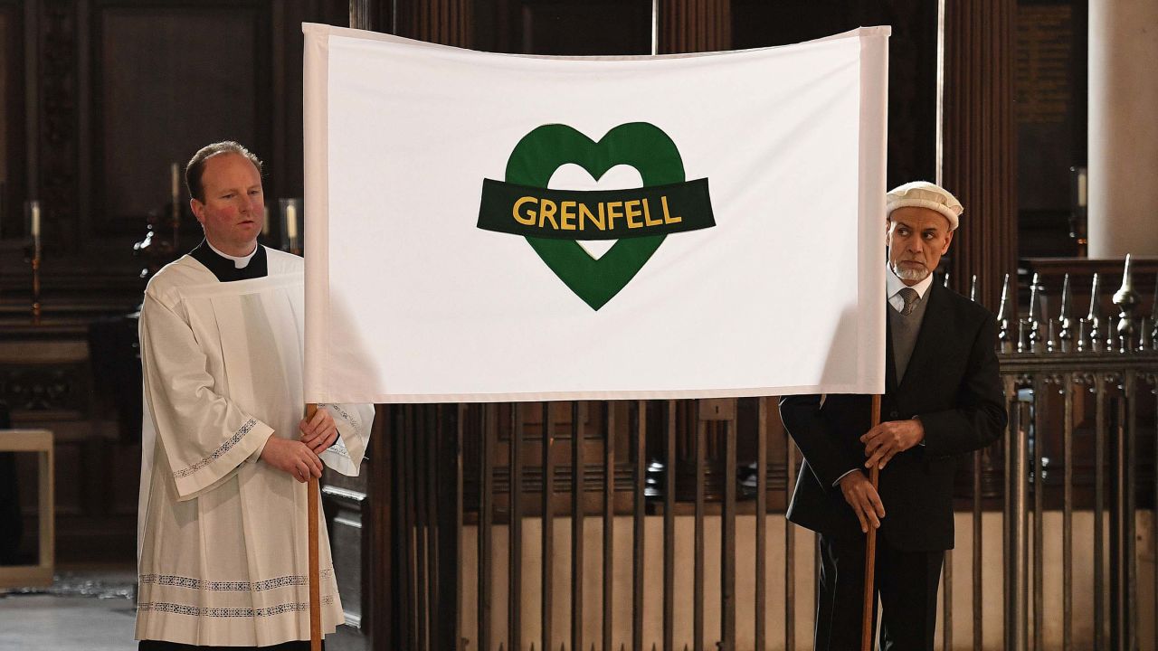 Attendees hold a banner during the service at the London cathedral.