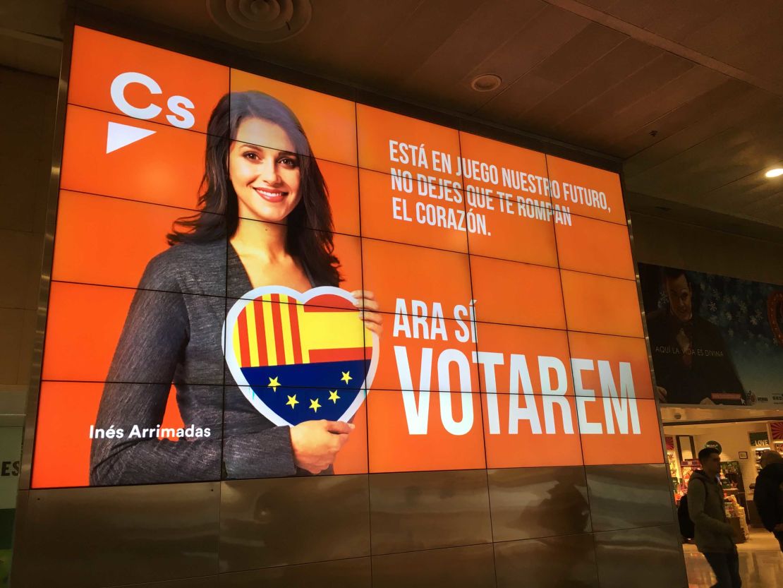 An electronic campaign poster of Inés Arrimadas, lead candidate for the anti-independence  Ciutadans party, at the Barcelona Sants train station.