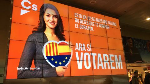An electronic campaign poster of Inés Arrimadas, lead candidate for the anti-independence Ciutadans party, at the Barcelona Sants train station.