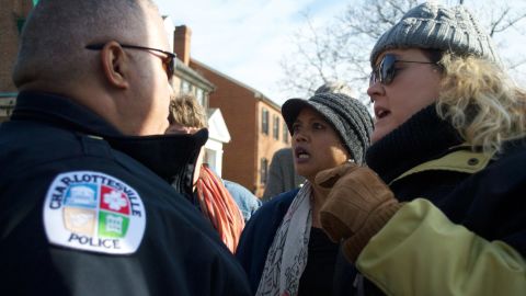 Protesters shout down the conversation between Davis and Snuffer.