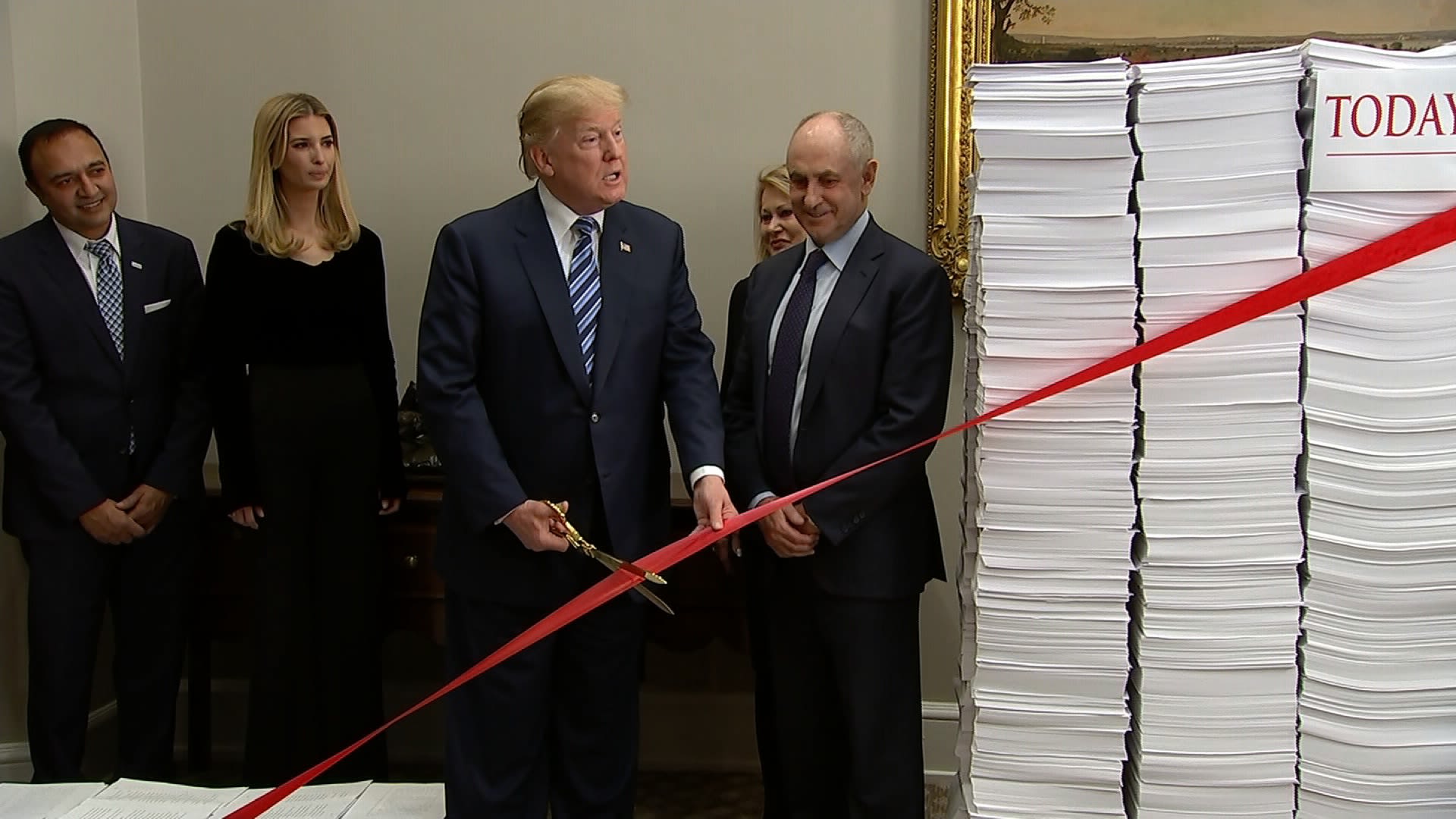 U.S President Donald Trump, center, joins a ribbon cutting