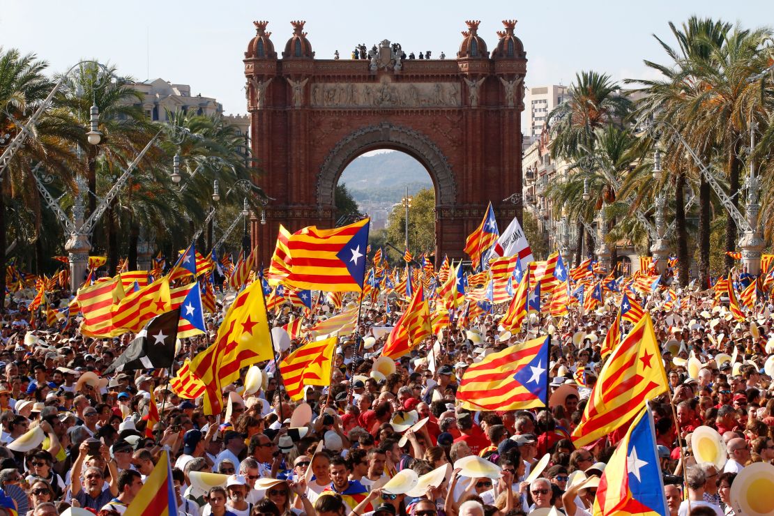 People wave the pro-independence Catalan flag at a rally on September 11, 2016, in Barcelona.