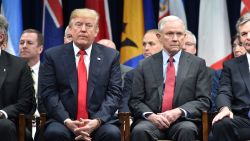 President Donald Trump sits with Attorney General Jeff Sessions on December 15, 2017 in Quantico, Virginia, before participating in the FBI National Academy graduation ceremony.