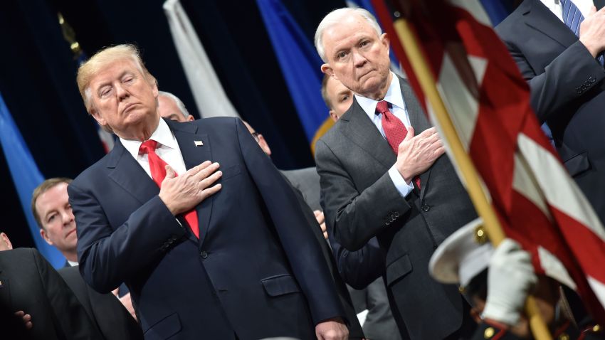 President Donald Trump stands with Attorney General Jeff Sessions on December 15, 2017 in Quantico, Virginia, before participating in the FBI National Academy graduation ceremony.