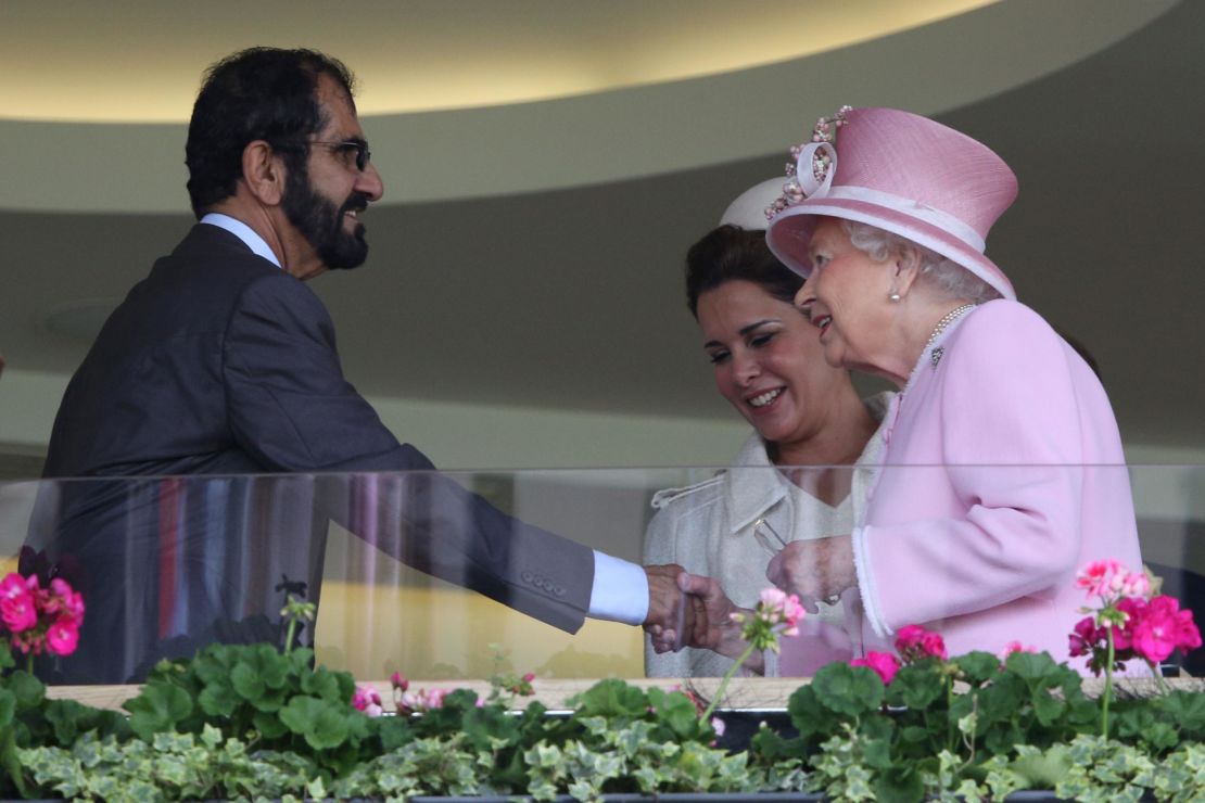 Britain's Queen Elizabeth greets Sheikh Mohammed and his wife in Ascot's Royal Box.