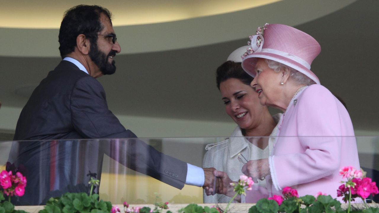 Britain's Queen Elizabeth greets Sheikh Mohammed and his wife in Ascot's Royal Box.