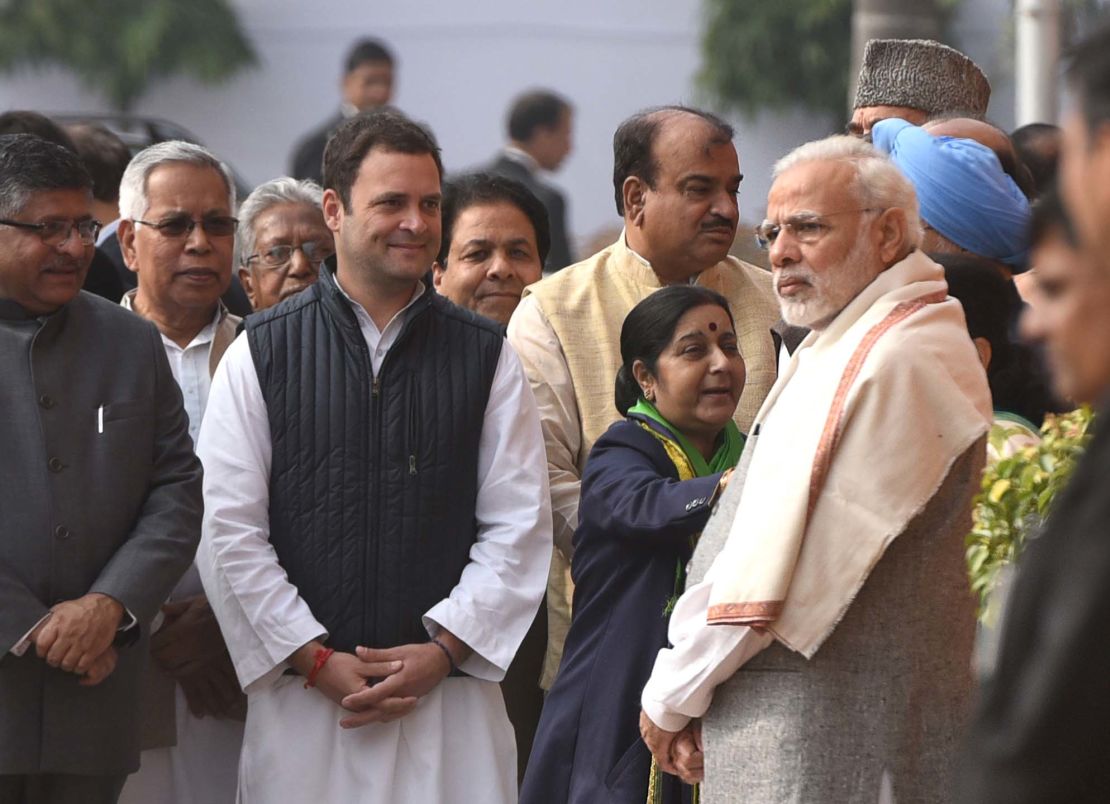 Indian Prime Minister Narendra Modi (R) stands near Rahul Gandhi (L) during the anniversary of the 2001 Parliament Attack at Parliament House on December 13, 2017, in New Delhi.