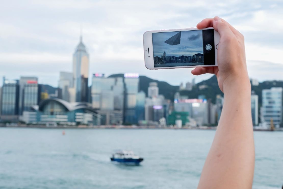 A user uses augmented reality on his phone in Hong Kong. The AR used here was part of a Star Wars promotional campaign in the city.