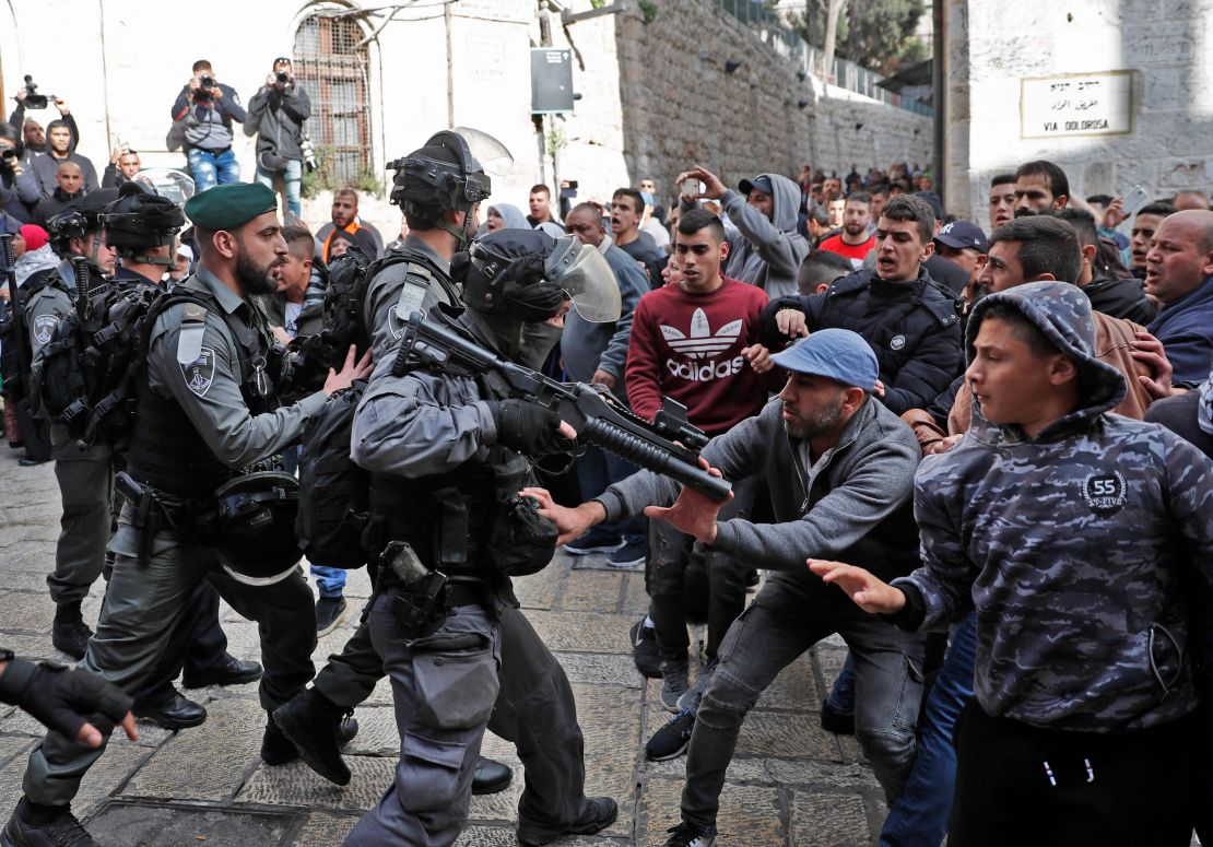 Israeli forces confront Palestinian protesters in Jerusalem's Old City on Friday.