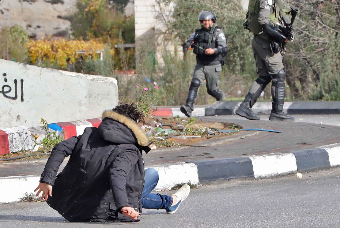 Israeli forces shoot at a Palestinian man after he allegedly stabbed a soldier in al-Bireh on Friday.