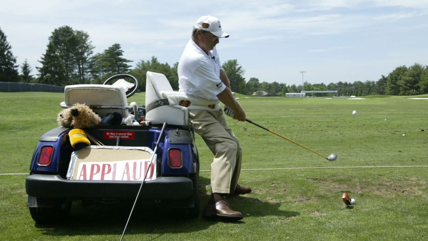 UNITED STATES - JUNE 07:  Trick shot artist Dennis Walters provides instruction to youngsters during the Citrix Junior Clinic at the Congressional Country Club in Bethesda, Maryland, Tuesday, June 7, 2005.  (Photo by Hunter Martin/Getty Images)
