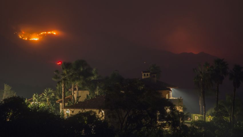 MONTECITO, CA - DECEMBER 16: Flames threaten homes at the Thomas Fire on December 16, 2017 in Montecito, California. The National Weather Service has issued red flag warnings of dangerous fire weather in Southern California for the duration of the weekend. Prior to the weekend, Los Angeles and Ventura counties had 12 consecutive days of red flag fire warnings, the longest sustained period of fire weather warnings on record. The Thomas Fire is currently the fourth largest California fire since records began in 1932, growing to 400 square miles and destroying more than 1,000 structures since it began on December 4. (Photo by David McNew/Getty Images)
