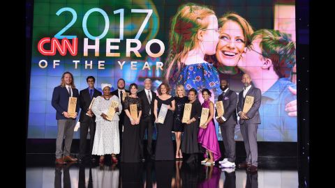 Anderson Cooper and Kelly Ripa with the 2017 Top 10 CNN Heroes, from left to right: Andrew Manzi, Samir Lakhani, Rosie Mashale, Stan Hays, Leslie Morissette, Anderson Cooper, Amy Wright, Kelly Ripa, Jennifer Maddox, Mona Patel, Khali Sweeney, and Aaron Valencia.