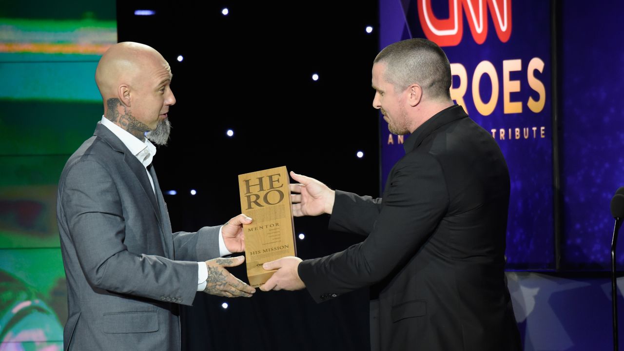 2017 CNN Hero Aaron Valencia, left, accepts his award from actor Christian Bale.