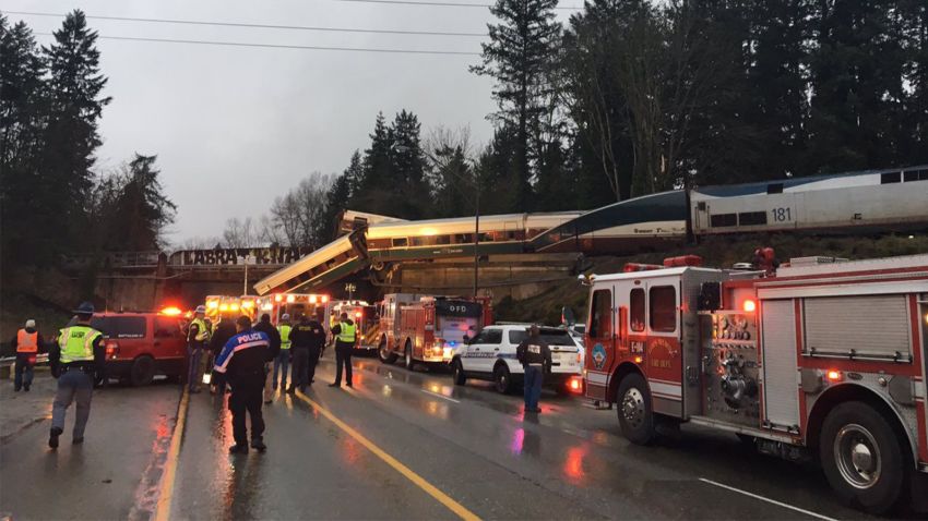 An Amtrak train car derailed and is dangling on to Interstate 5 in Pierce County, Washington, according to the Washington State Department of Transportation's twitter. All southbound lanes of the I-5 are closed due to the derailment.