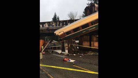 An Amtrak train car dangled onto Interstate 5 in Pierce County, Washington, after it derailed in December.