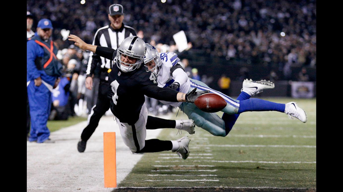 Oakland quarterback Derek Carr reaches for the goal line but fumbles out of the end zone during an NFL game against Dallas on Sunday, December 17. The late-game touchback ended the Raiders' hopes of winning the game.
