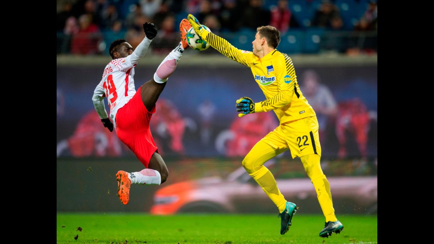 RB Leipzig forward Jean-Kevin Augustin and Hertha Berlin goalkeeper Rune Jarstein compete for the ball during a German league soccer match on Sunday, December 17.