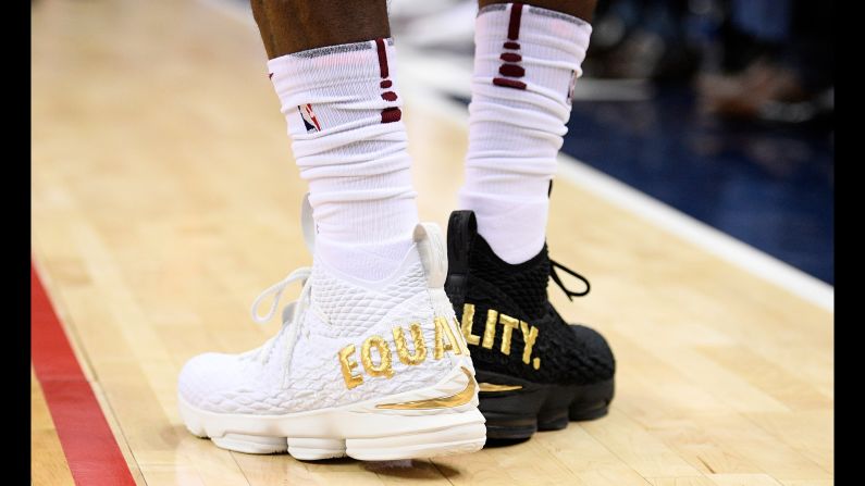 Cleveland superstar LeBron James wears one white shoe and one black shoe during an NBA game in Washington on Sunday, December 17. <a href="index.php?page=&url=http%3A%2F%2Fbleacherreport.com%2Farticles%2F2749806-lebron-james-on-wearing-equality-shoes-not-going-to-let-1-person-dictate-us" target="_blank" target="_blank">Read more on LeBron's statement about equality</a>