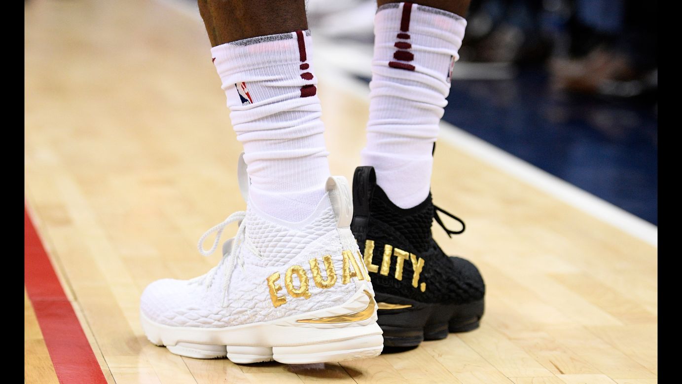 Cleveland superstar LeBron James wears one white shoe and one black shoe during an NBA game in Washington on Sunday, December 17. <a href="http://bleacherreport.com/articles/2749806-lebron-james-on-wearing-equality-shoes-not-going-to-let-1-person-dictate-us" target="_blank" target="_blank">Read more on LeBron's statement about equality</a>