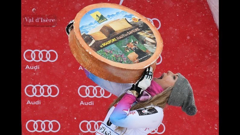 American skier Lindsey Vonn celebrates with a wheel of cheese after <a href="index.php?page=&url=http%3A%2F%2Fwww.cnn.com%2F2017%2F12%2F16%2Fsport%2Flindsey-vonn-skiing-world-cup-val-disere%2Findex.html" target="_blank">winning a World Cup super-G race</a> in Val-d'Isere, France, on Saturday, December 16. It was Vonn's first victory since a downhill race in January.