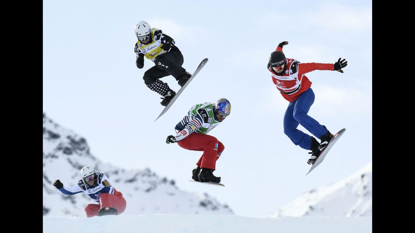 From left, snowboarders Fabio Corbi, Regino Hernandez, Nate Holland and Alex Pullin compete in a World Cup race at the French ski resort of Val Thorens on Wednesday, December 13.