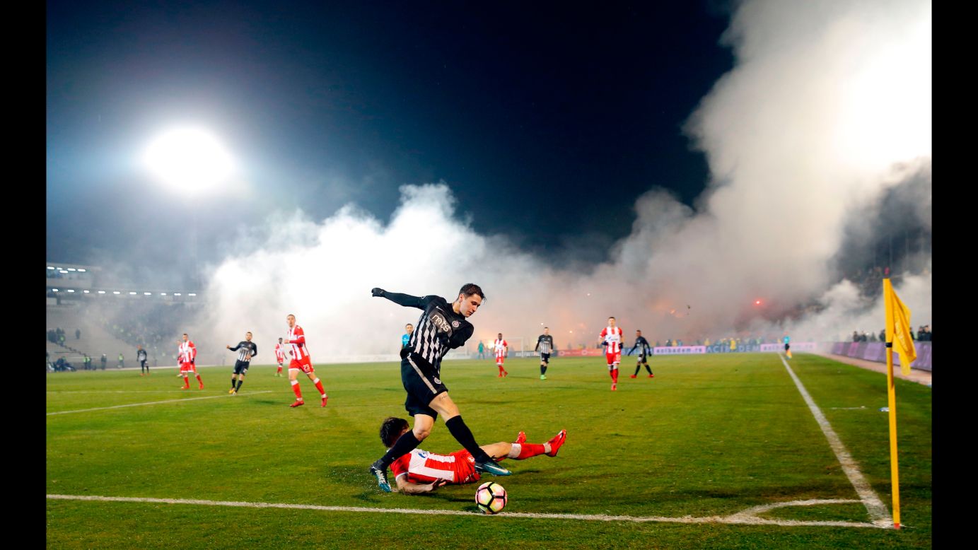Smoke rises from the stands during a Serbian league match between rivals Partizan Belgrade and Red Star Belgrade on Wednesday, December 13.