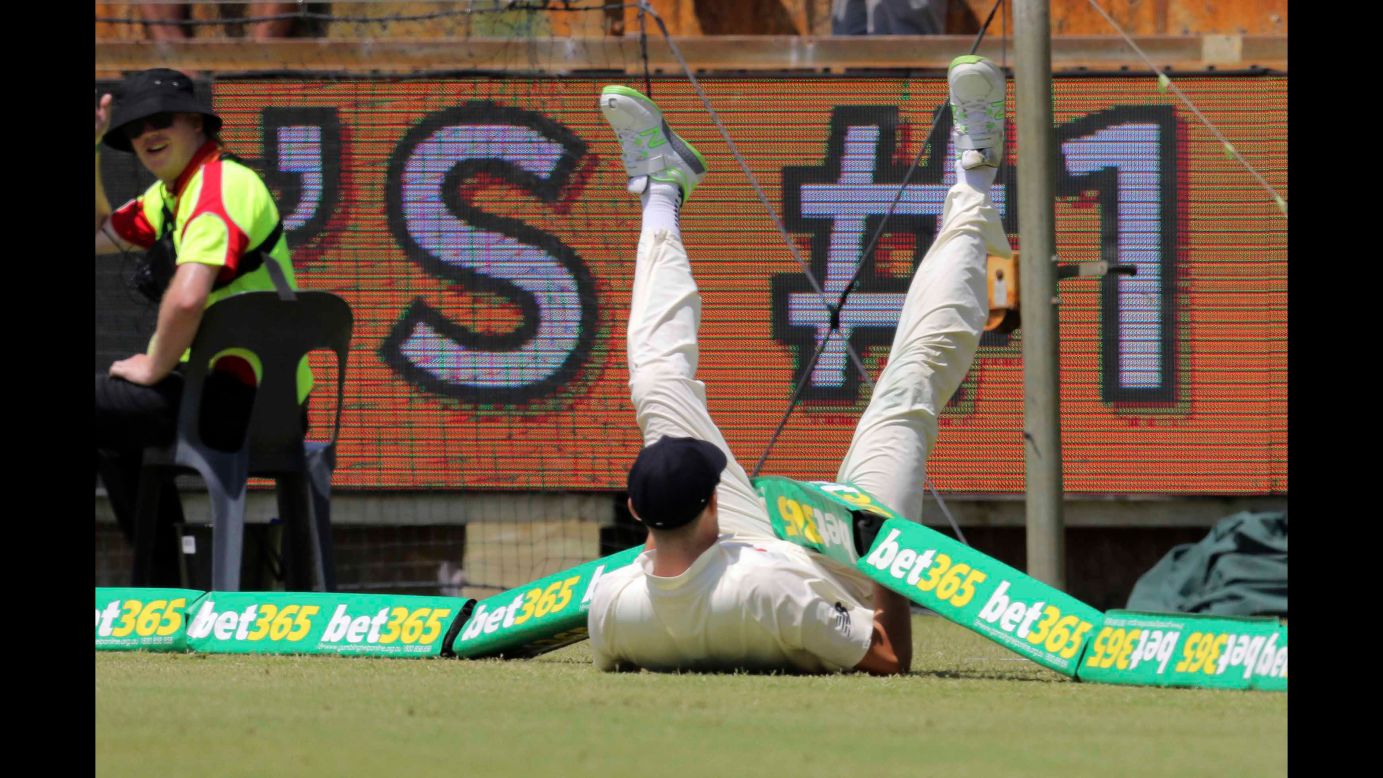 England cricketer Craig Overton gets tangled in the boundary during an Ashes match in Perth, Australia, on Saturday, December 16.