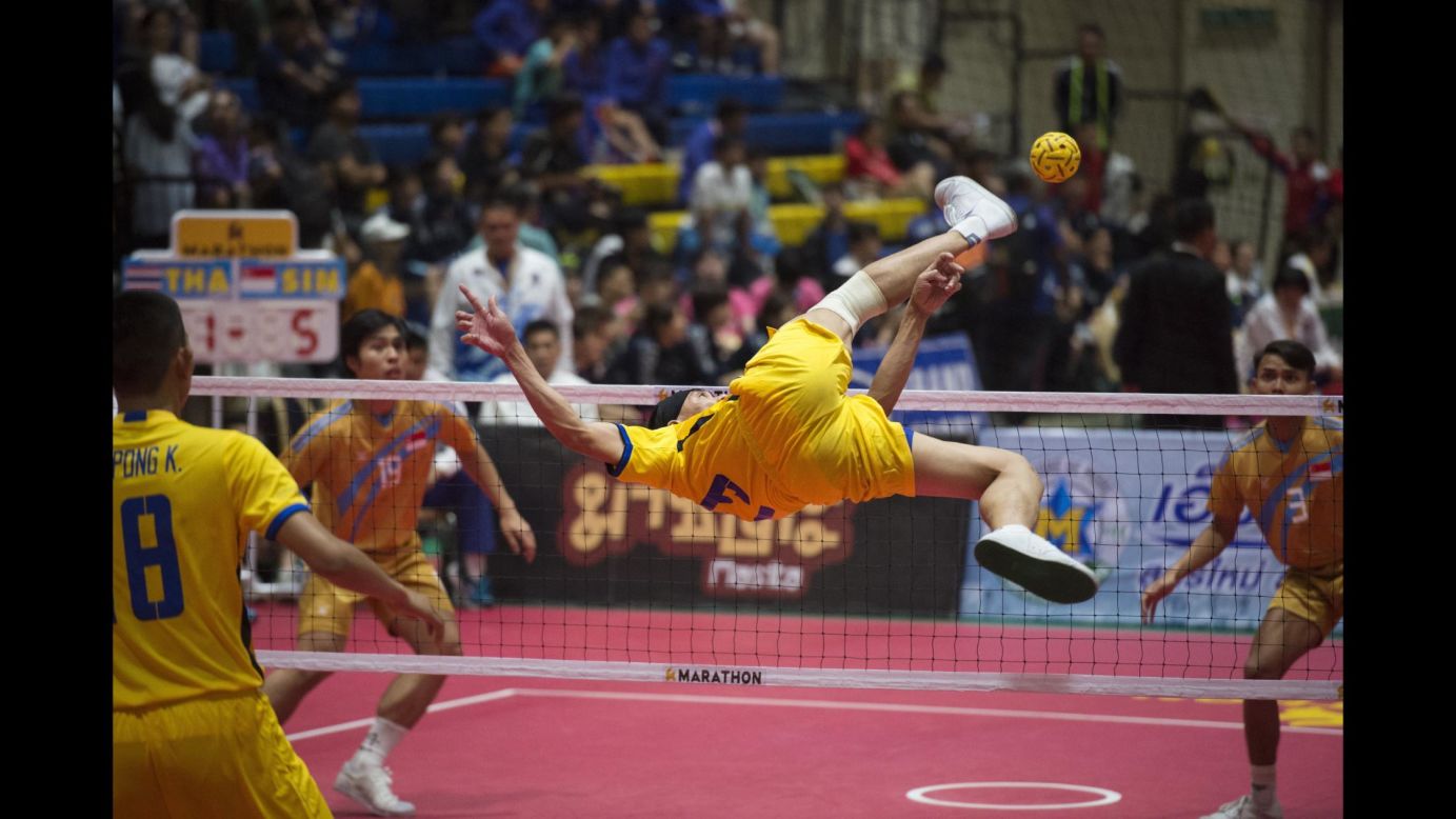 A sepak takraw player from Thailand spikes the ball over the net during a King's Cup match against Singapore on Thursday, December 14.
