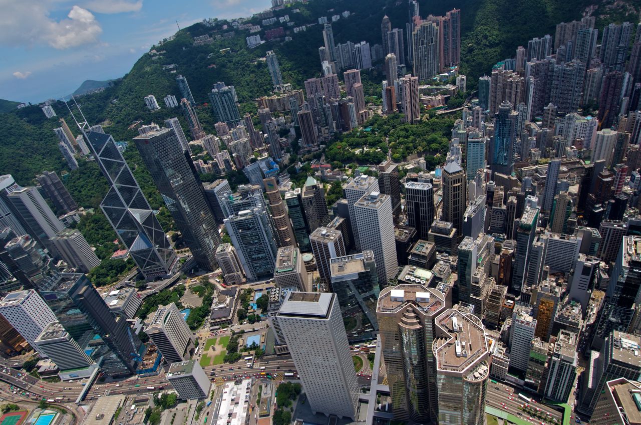 An aerial view of Central Hong Kong from the rooftop of IFC 2 highlights how distinctive the Bank of China Tower is in design. Other buildings that can be seen include the Cheung Kong Centre, the HSBC headquarters, the Legislative Council building, and Jardine House.  