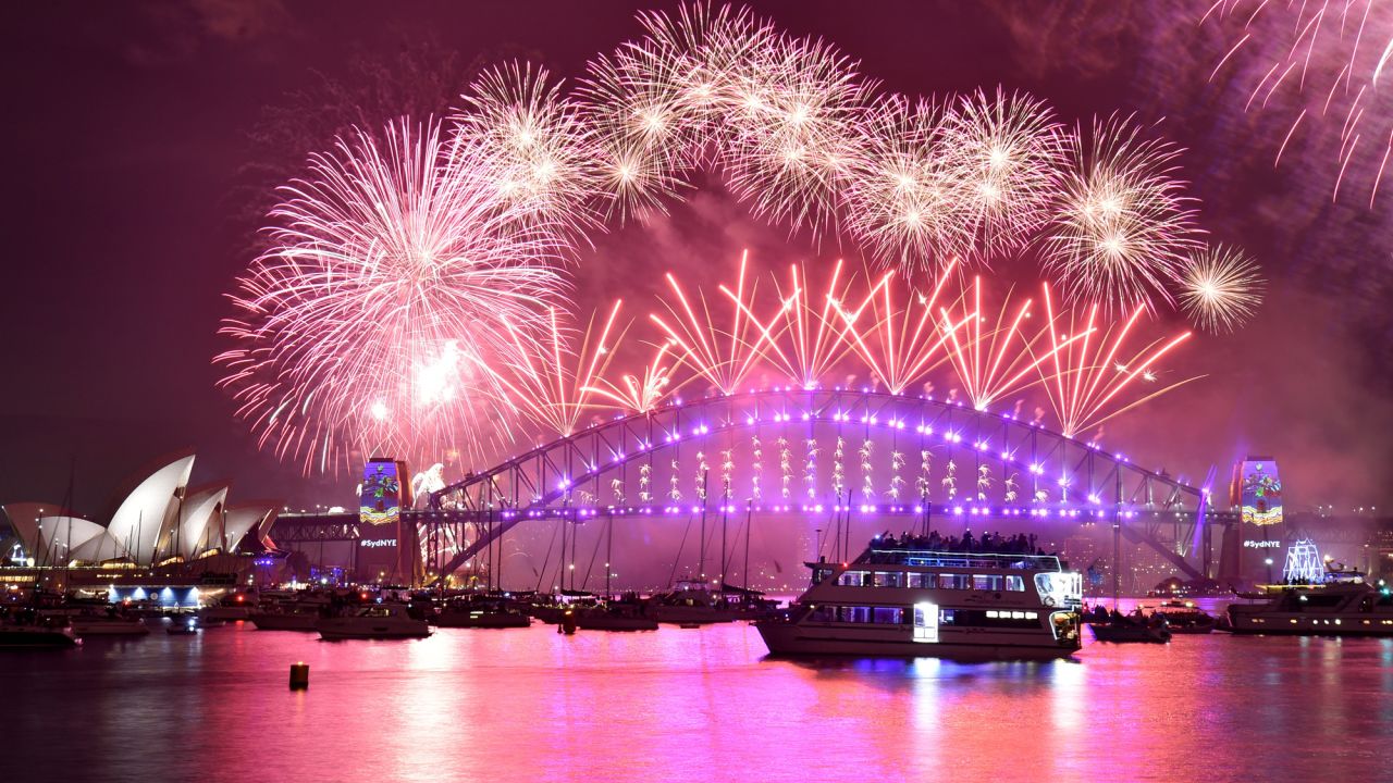 <strong>Sydney, Australia:</strong> Fireworks erupt over Sydney's iconic Harbour Bridge and Opera House. Click through the gallery for more photos of New Year's destinations around the world: