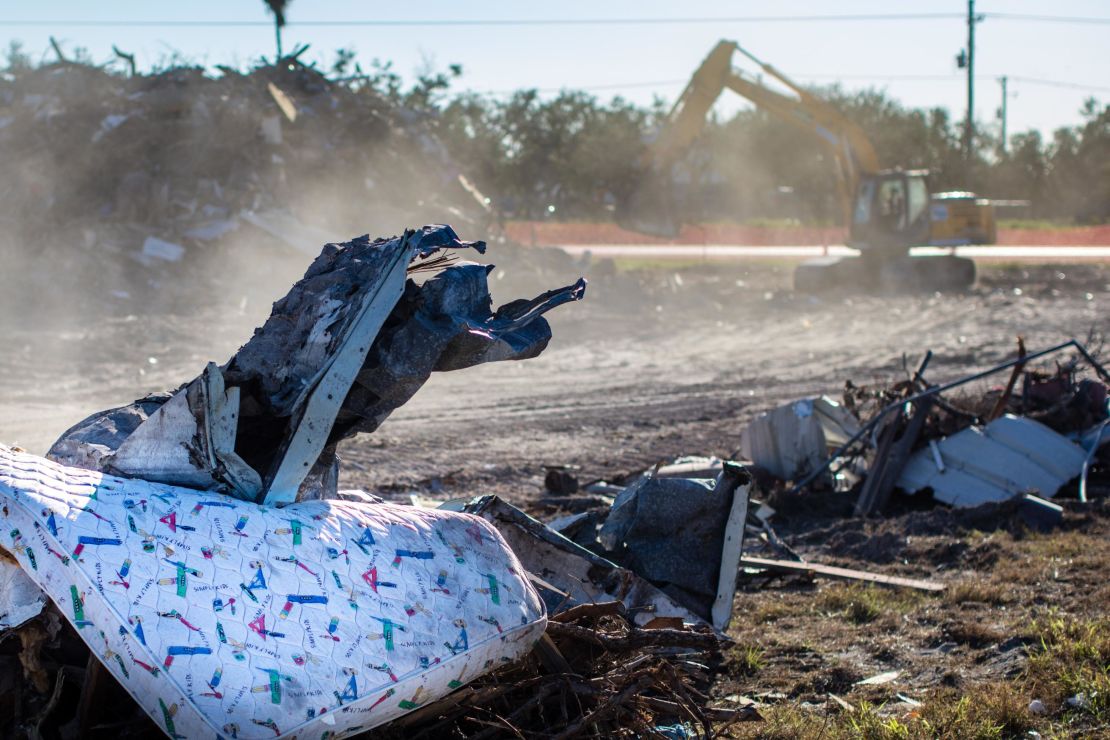 Trash is still everywhere after Hurricane Harvey hit Rockport. In the background, a backhoe continues the cleanup. 