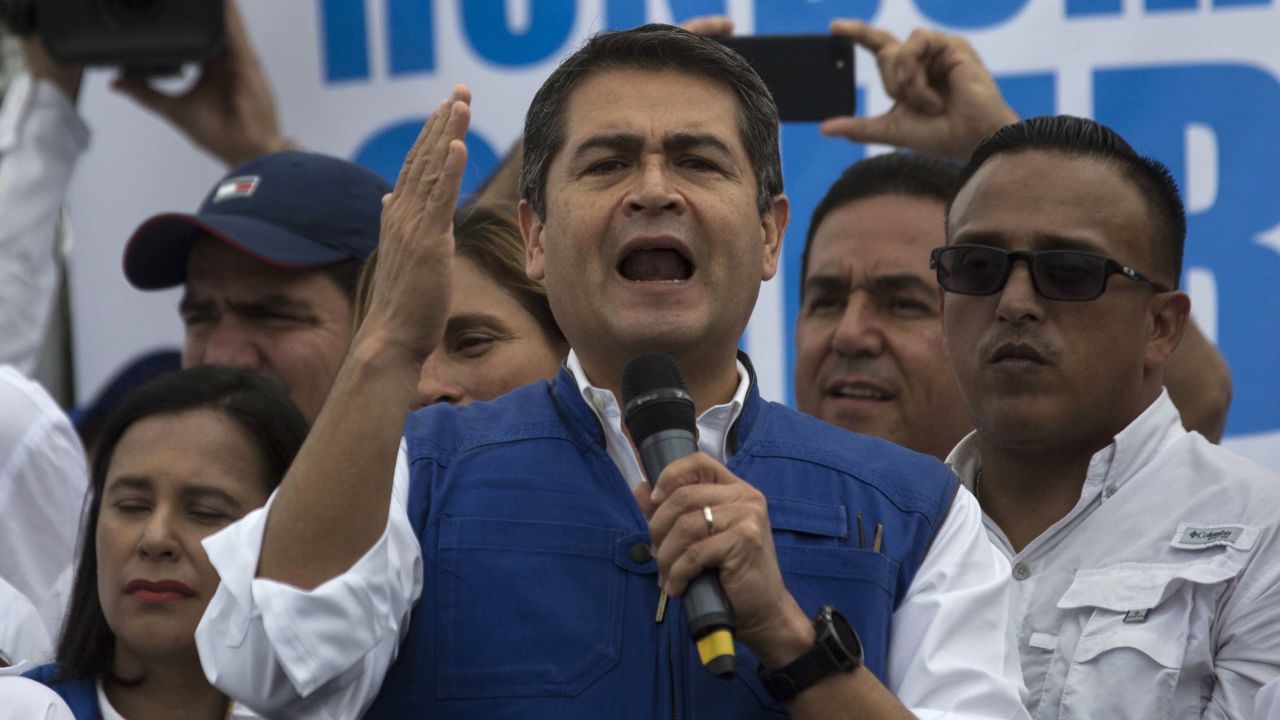 Honduran President Juan Orlando Hernandez speaks to his party base, in Tegucigalpa, Honduras, Thursday, Dec. 7, 2017.