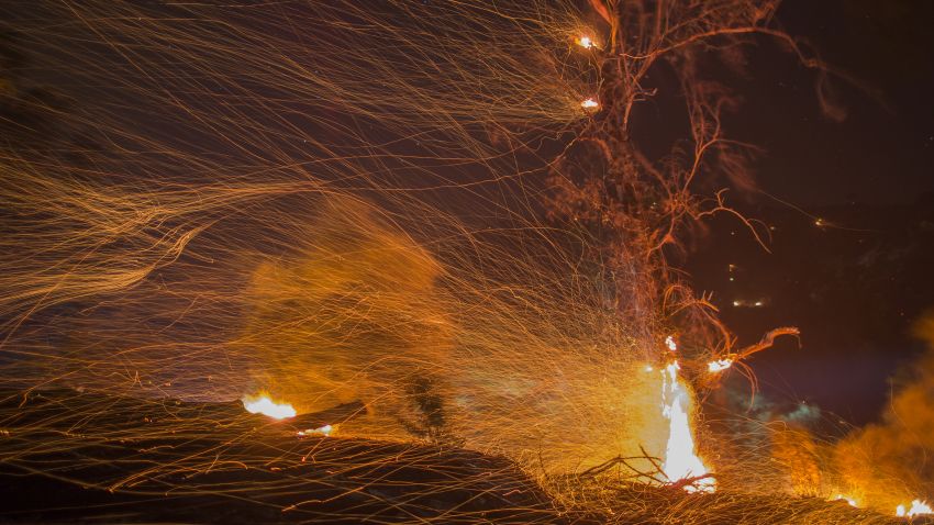 MONTECITO, CA - DECEMBER 16: A strong wind blows embers at the Thomas Fire on December 16, 2017 in Montecito, California. The National Weather Service has issued red flag warnings of dangerous fire weather in Southern California for the duration of the weekend. Prior to the weekend, Los Angeles and Ventura counties had 12 consecutive days of red flag fire warnings, the longest sustained period of fire weather warnings on record. The Thomas Fire is currently the fourth largest California fire since records began in 1932, growing to 400 square miles and destroying more than 1,000 structures since it began on December 4. (Photo by David McNew/Getty Images)