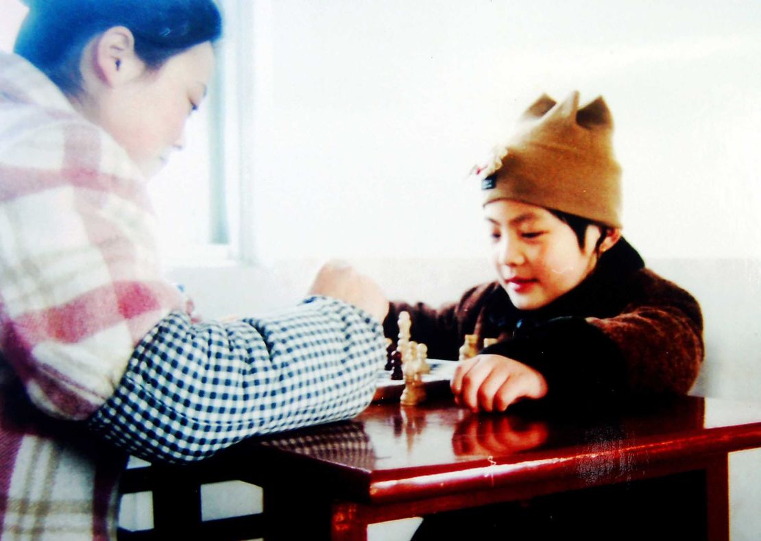 Hou (pictured) first learnt chess at the age of five.