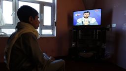 epa06398635 A Yemeni watches Houthi rebel commander Abdel-Malik al-Houthi delivering a speech on the pro-Houthi Al-Maseera television, after his rebels fired a missile at Saudi Arabia, in Sana?a, Yemen, 19 December 2017. According to reports on 19 December, Houthi rebels in Yemen fired a missile that was intercepted near Riyadh. This is the second incident after a similar missile in November missed Riyadh's airport.  EPA-EFE/YAHYA ARHAB