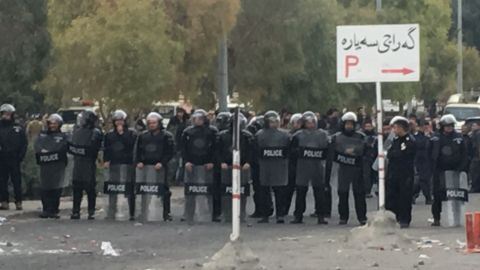 Security forces block the road during the anti-government protests in Sulaymaniyah.