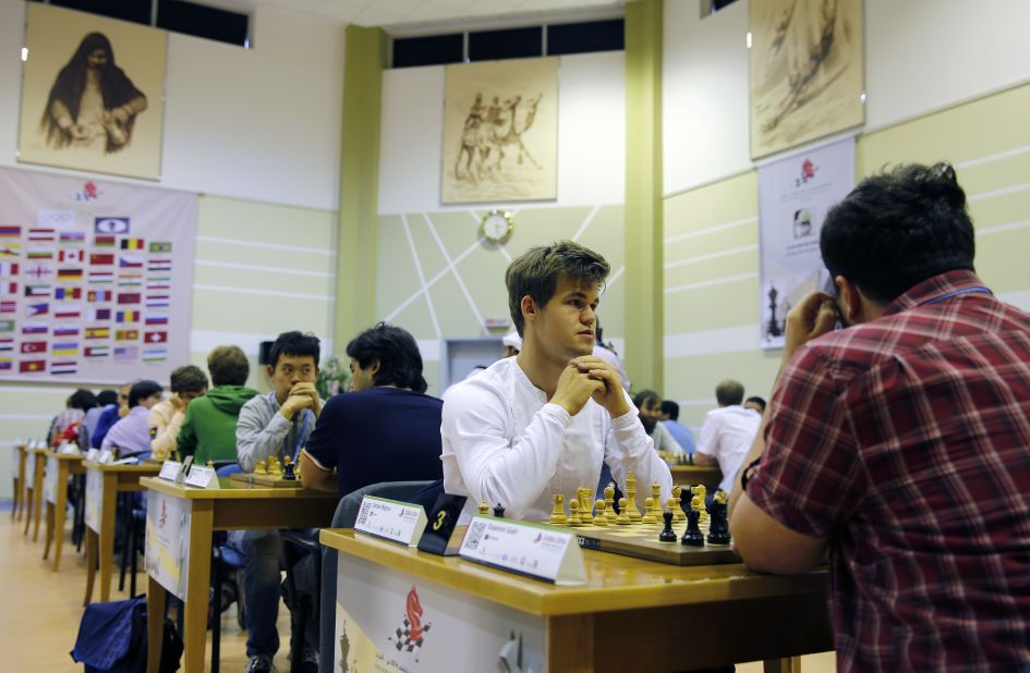 In 2014, Carlsen (pictured here at the World Rapid and Blitz Championships in Dubai 2014) became the first player to hold the World Champion title in Standard, Rapid and Blitz chess.  <br />